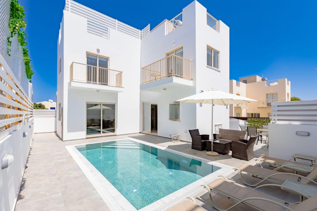 La Villa exterior with private swimming pool and sun loungers