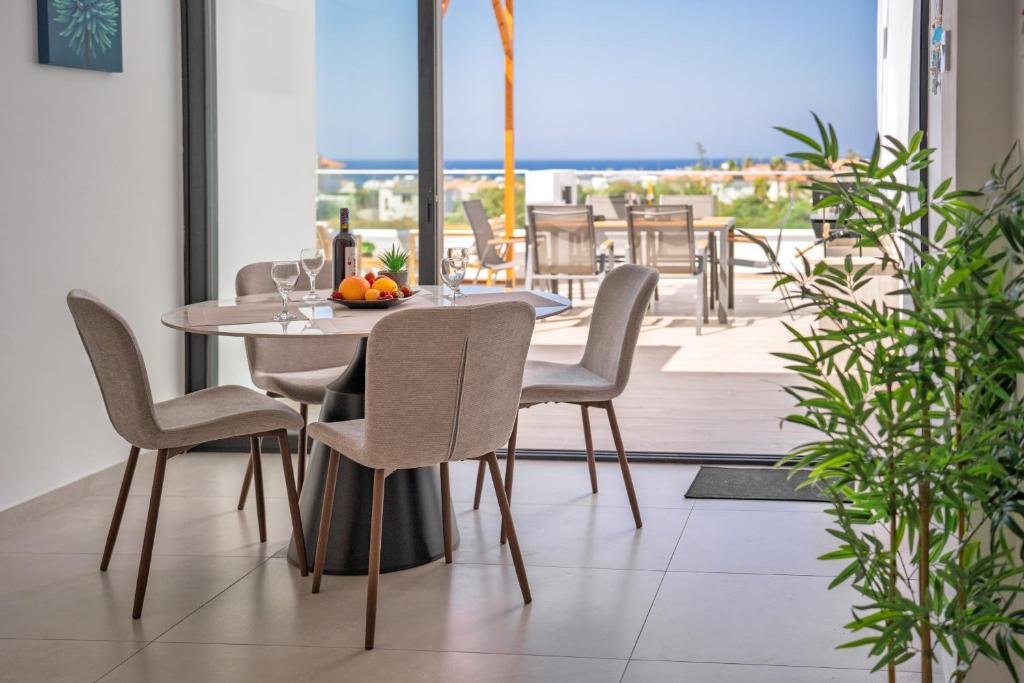 SeaVibe dining area opening onto a sea-view terrace