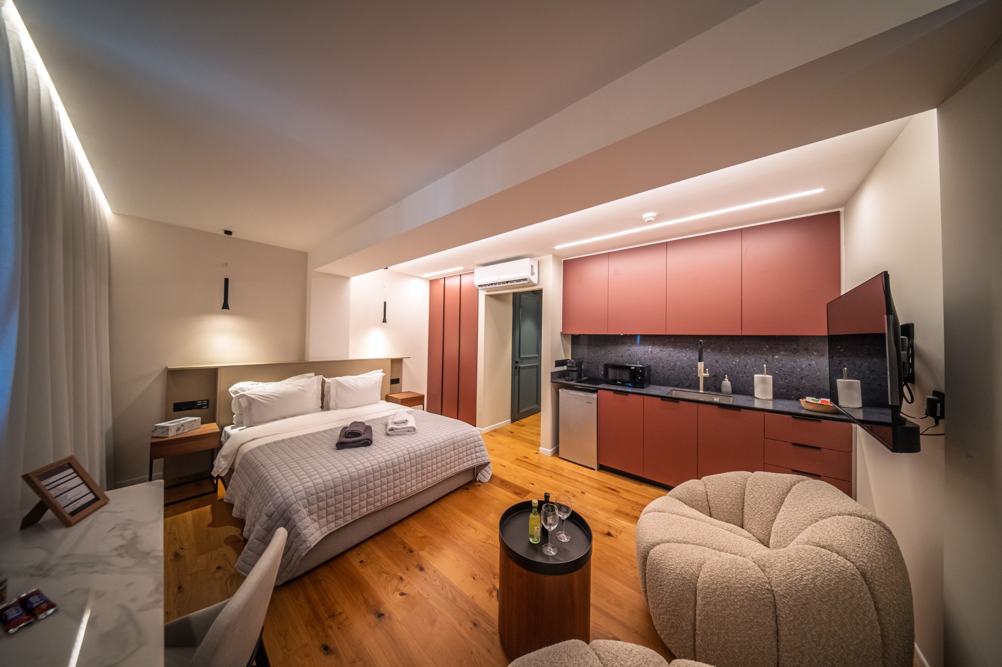 Sky Suites Nicosia bedroom with kitchenette and sitting area